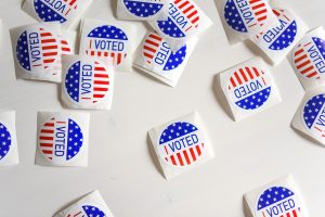 Several "I voted" stickers on a white background